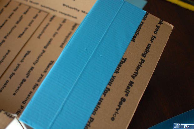 Start by taping your military birthday care package with colored duck tape. (Military.com))