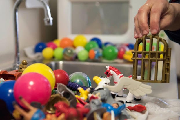 Soha Dobbins, a Children’s Waiting Room child specialist, washes toys used in the Children’s Waiting Room at Joint Base Elmendorf-Richardson, Alaska. (U.S. Air Force/Crystal A. Jenkins)