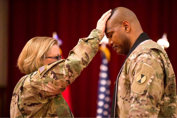 Lt. Col. Khallid Shabazz, right, participates in his Change of Stole ceremony inside the Lewis Main Chapel at Joint Base Lewis-McChord, Wash., May 23, 2017. Shabazz became the chaplain for the 7th Infantry Division during the ceremony, making him the Army's first Islamic chaplain at the division level. (Courtesy photo)