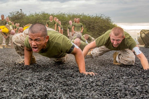 Marine Corps recruits do warmup exercises before martial arts training at Marine Corps Recruit Depot San Diego, Oct. 1, 2018. (U.S. Marine Corps photo by Lance Cpl. Christian Garcia)