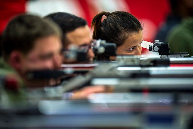 Marine Corps Lance Cpl. Faheemah Bostan-Ali looks down the sight of an air rifle at Camp Lejeune, N.C., March 23, 2018, during the 2018 Marine Corps Trials, an event that helps select participants for the DoD Warrior Games. (U.S. Marine Corps photo by Sgt. Drew Tech)