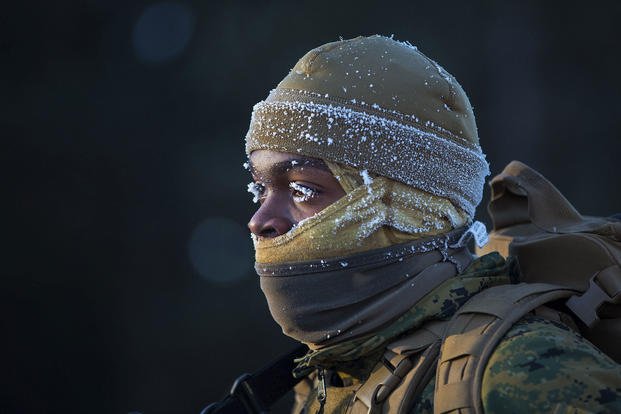 Marine Corps Lance Cpl. Kwan Walker faces the cold during a conditioning hike as part of exercise Ullr Shield at Fort McCoy, Wis., Jan. 13, 2018. (Marine Corps photo by Lance Cpl. Cody Rowe)