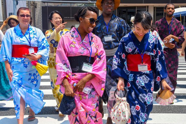 Sailors and family members wear yukata, a casual Japanese summer garment, during a community relations event in Yokosuka city, Japan, July 17, 2018. (U.S. Navy photo by Maria Dumanlang)