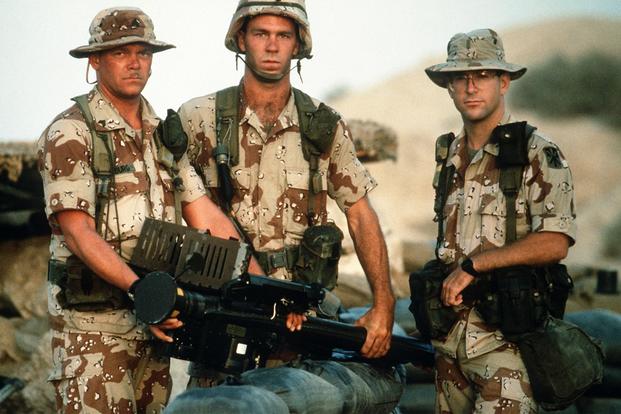 Soldiers from the 11th Air Defense Artillery pose with a Stinger missile launcher during Operation Desert Shield. (Photo Credit: Staff Sgt. F. Lee Corkran)
