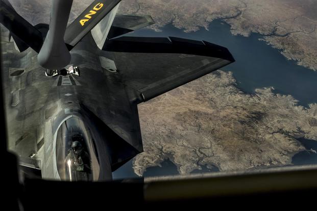 A U.S. Air Force F-22 Raptor approaches a KC-135 Stratotanker for an in-flight refuel mission over the Euphrates River in Iraq in support of Operation Inherent Resolve Sept. 1, 2018. (U.S. Air Force photo by Senior Airman Xavier Navarro)