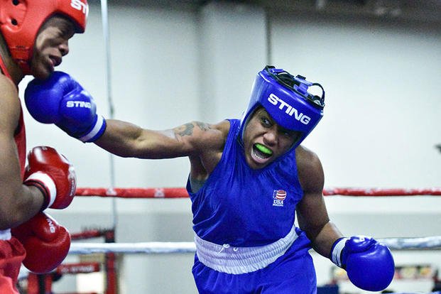Staff Sgt. Naomi Graham throws a right to the chin of Briana Che during a USA nationals bout the first week of December in Salt Lake City, Utah. Graham rose through the ranks of USA Boxing after picking up the sport five years ago. (U.S. Army photo/Nathaniel Garcia)