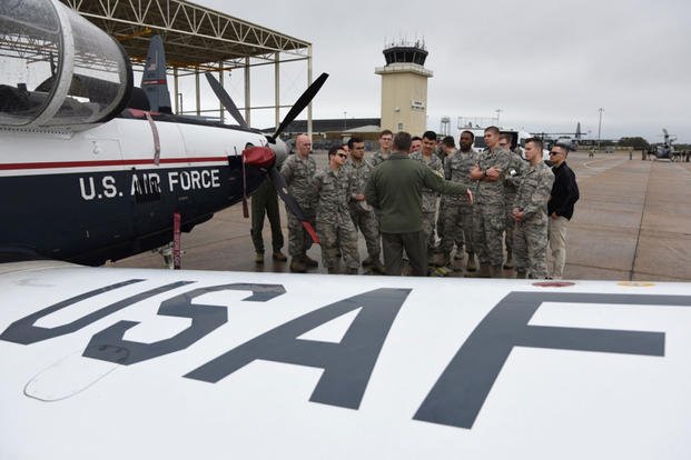 U.S. Air Force Maj. Thomas Martin, 37th Flying Training Squadron instructor pilot, Columbus Air Force Base, Mississippi, briefs Air Force ROTC cadets on a T-6 Texan II static display during the fifth annual Pathways to Blue on Keesler Air Force Base, Mississippi, April 5, 2019. (U.S. Air Force photo/Kemberly Groue)