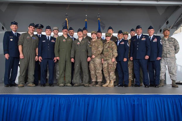 Gen. Mike Holmes, left, Air Combat Command commander, poses with the 74th Fighter Squadron (FS) during the Gallant Unit Citation presentation, March 14, 2019, at Moody Air Force Base, Ga. (U.S. Air Force photo/Taryn Butler)