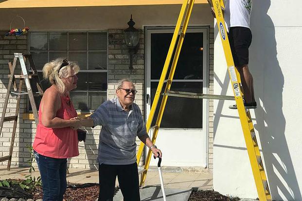 Dozens of members of the Hillsborough County Fire Rescue and their families painted the house belonging to William Velez, a blind World War II veteran, on April 13, 2019. Facebook photo