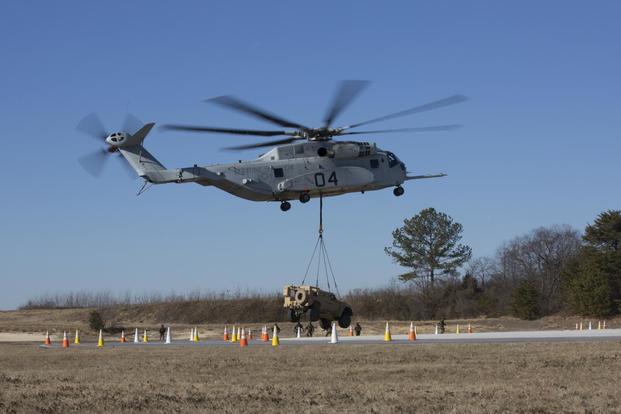 The CH-53K King Stallion lifts a Joint Light Tactical Vehicle (JLTV) at Naval Air Station Patuxent River, Maryland, January 18, 2018. (U.S. Marine Corps/Lance Cpl. Shannon Doherty)