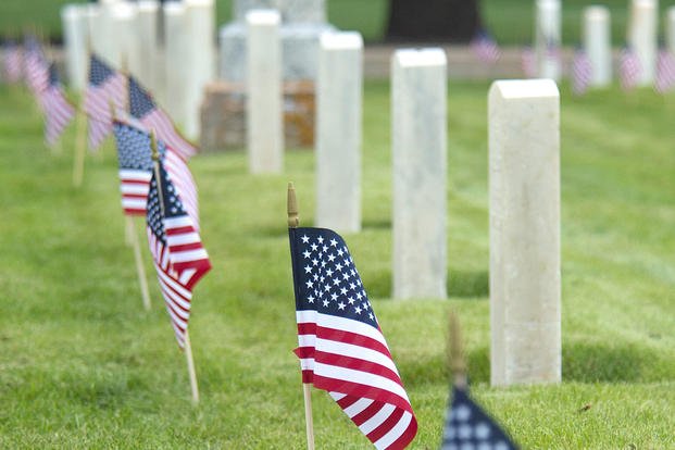 Flags line a row of tombstones in the F.E. Warren Air Force Base, Wyo., base cemetery May 21, 2015. (U.S. Air Force photo/R.J. Oriez)