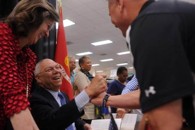 In this file photo, retired Army General Colin Powell shakes hands at the Marine Corps Exchange aboard Marine Corps Base Quantico, Virginia. Powell visited the exchange during a book signing of his newest work, "It Worked For Me: In Life and Leadership," released May 22, 2013. (Samuel Ellis/U.S. Marine Corps)