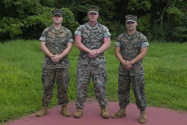 U.S. Marines from Communications Company, Headquarters Battalion, 3rd Marine Division, pose for a photo on Camp Courtney, Okinawa, Japan, on July 17, 2019. The Marines showed heroic actions on July 14, 2019, at Mermaid's Gratto by attempting to save swimmers in need. (U.S. Marine Corps photo by Sgt. Trystan Jordan)