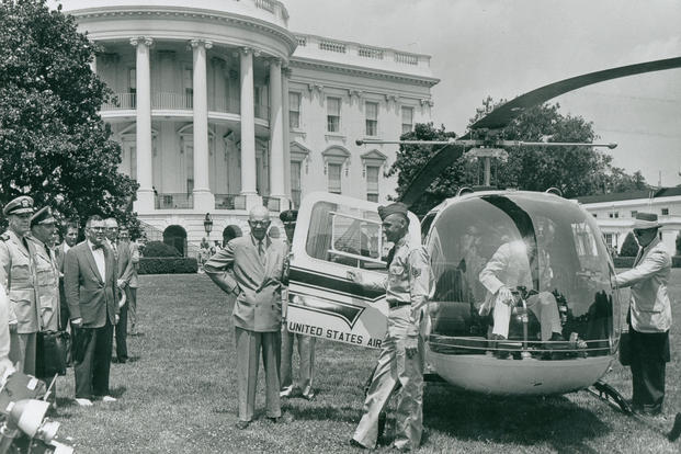 President Dwight D. Eisenhower posing next to the first presidential helicopter, a Bell UH-13J Sioux, on the South Lawn of the White House Grounds. Although presidents had used airplanes to travel for some time, helicopters were not adopted for use as presidential conveyance until Eisenhower's administration. (White House Historical Association)
