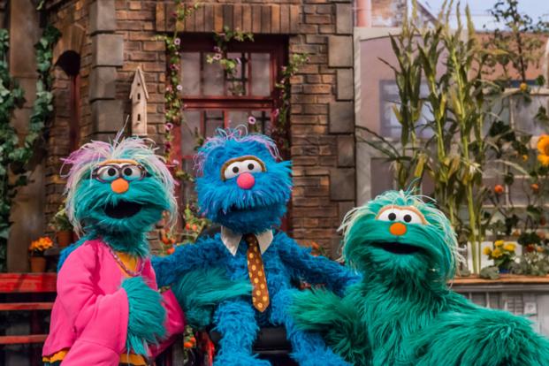 A new Sesame Street family includes a caregiver.