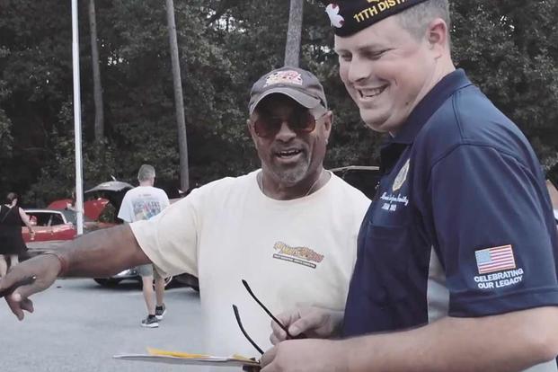Derric Grimes, shown on the right in this screengrab from a November 2018 American Legion video, is an Army veteran and post member who wants the organization to move to a more family and community-oriented focus. Screengrab of American Legion video
