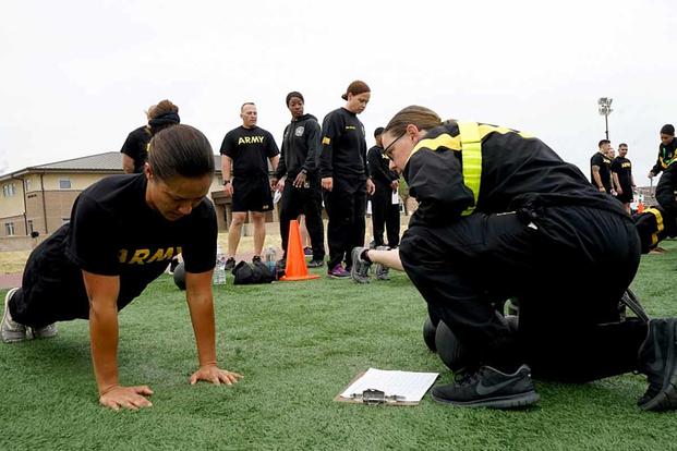 Capt. Lehuanani Halemano of the Hawaii Army National Guard performs hand-release push-ups during an Army Combat Fitness Test at Camp Parks in Dublin, Calif., on May 10, 2019. Halemano traveled to California to attend the ACFT training, which was intended to prepare instructors and graders for the impending 2020 roll out of the new physical readiness assessment. Photo by Spc. Amy Carle/U.S. Army National Guard