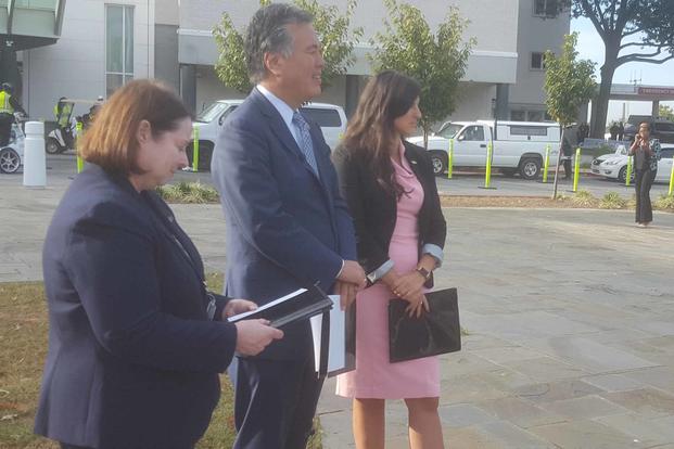 Navy Reserve Lt. Andrea Goldstein, right, was joined by Rep. Mark Takano, D-California, chairman of the House Veterans Affairs Committee, for a news conference in front of the Washington, D.C., VA Medical Center on Sept. 26, 2019, as she recounted an assault that took place there the previous week. Photo by Richard Sisk/Military.com