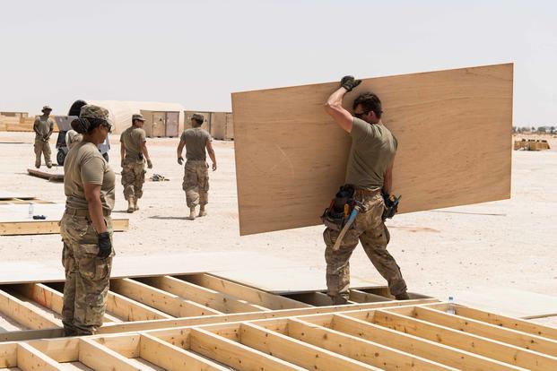 U.S. Army civil engineers build tent platforms for the primary U.S. Forces Life Support Area at Prince Sultan Air Base, Kingdom of Saudi Arabia, on July 24, 2019. (U.S. Air Force photo by Senior Airman Sean Campbell)