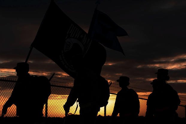 Airmen ruck march in honor of POW/MIA Recognition Day.