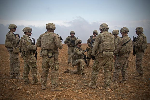 U.S. soldiers gather for a brief during a combined joint patrol rehearsal in Manbij, Syria, Nov. 7, 2018. (U.S. Army photo/Zoe Garbarino)