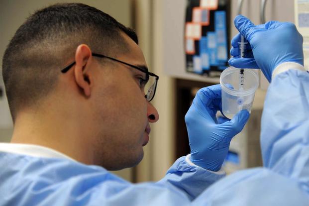 Staff Sgt. Michael Urena conducts a fertility test, July 12, 2012, Eielson Air Force Base, Alaska. (U.S. Air Force photo)