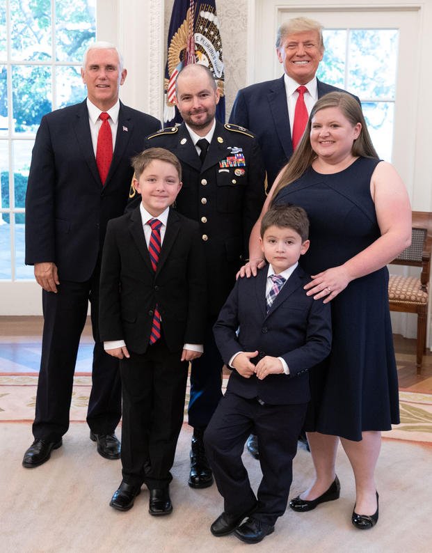 President Trump and Vice President Pence pose for a photo with Medal of Honor recipient retired U.S. Army Staff Sgt. Ronald J. Shurer II