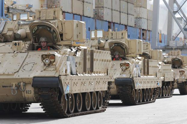 U.S. Army M2 Bradleys wait to be loaded for DEFENDER Europe-20.