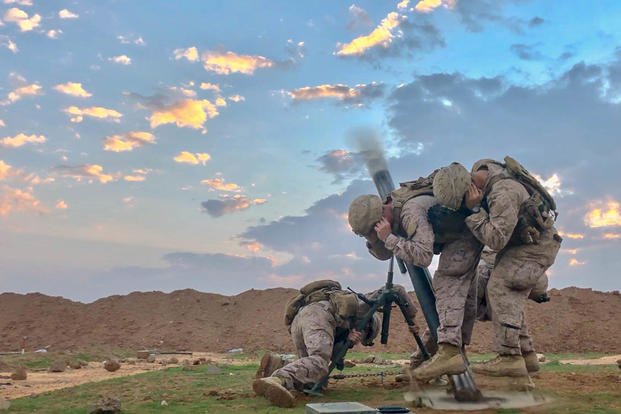 Marines fire an M120 Mortar during a mission in southwest Asia