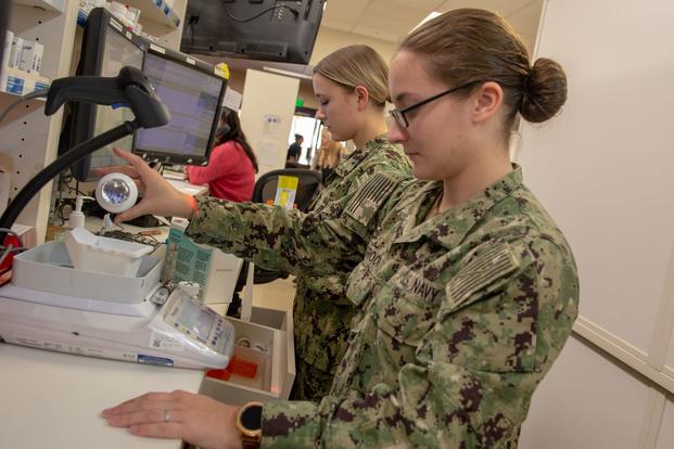 A pharmacy technician assigned to Naval Medical Center San Diego's main pharmacy fills prescriptions.