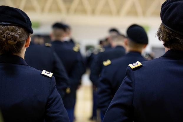 Soldiers of the 1st Theater Sustainment Command stand in formation during an in-ranks inspection.
