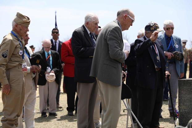 U.S. Marine Corps and Navy WWII vets pay their respects at the Reunion of Honor ceremony in 2019.