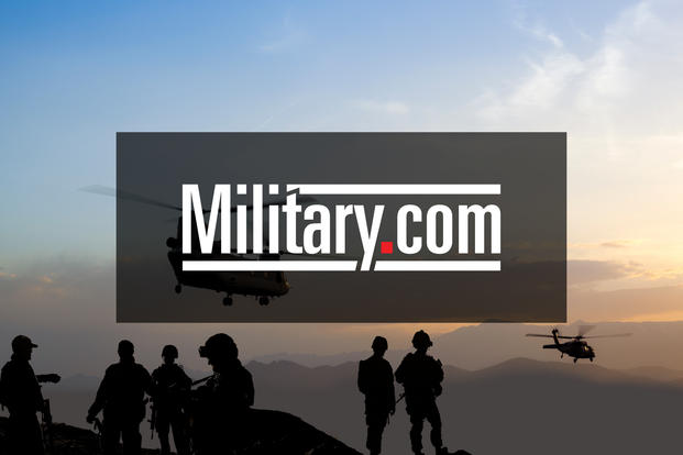 Troops load up into personnel carriers at the  Joint Force Headquarters of the D.C. National Guard.