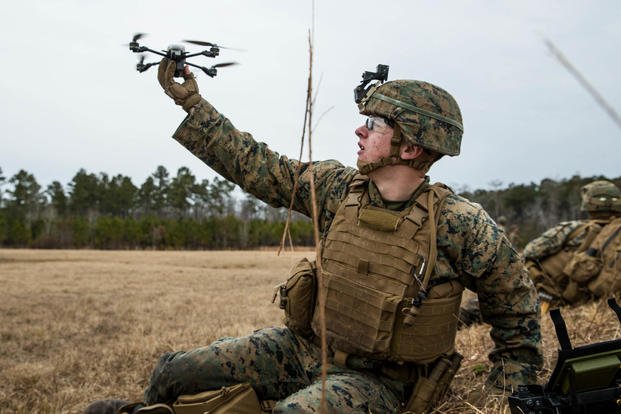 Marine rifleman releases a drone
