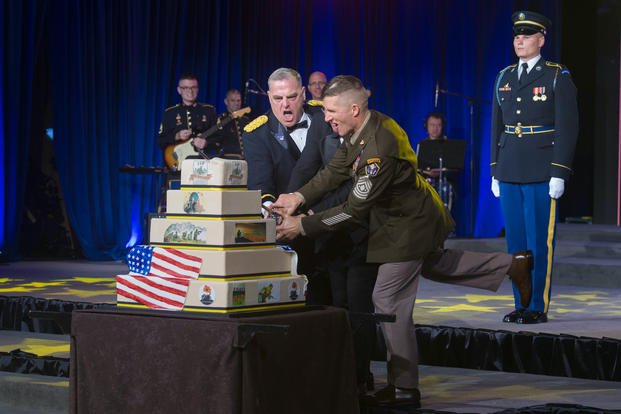 cutting the cake at the army birthday ball