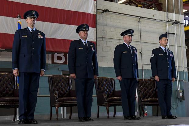 Airmen are presented with awards during a ceremony at Kirtland Air Force Base.