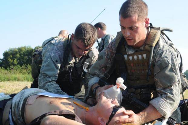 U.S. soldiers participating in the Special Forces qualification course try to revive a simulated casualty in Fort Bragg, N.C. 