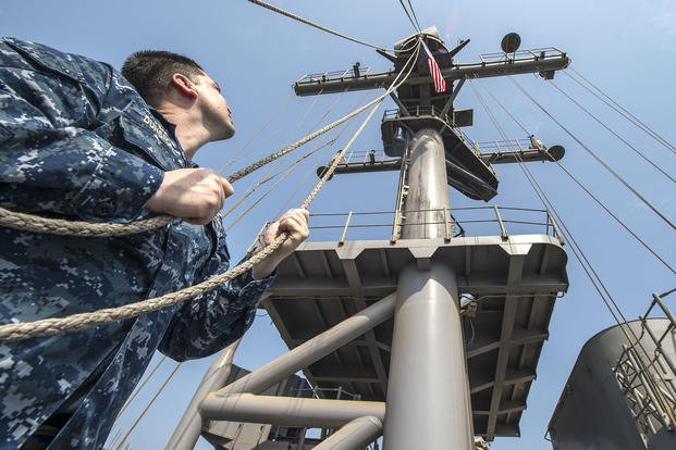 Navy Lieutenant raises United States Flag on USS Essex