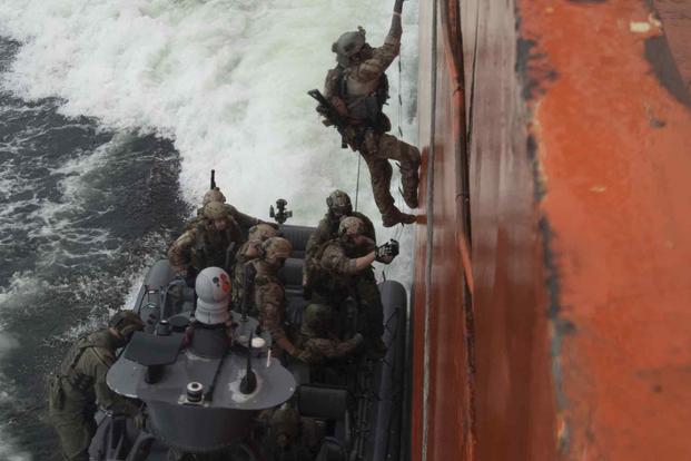U.S. and Danish special operations forces board a ship in the Baltic Sea.