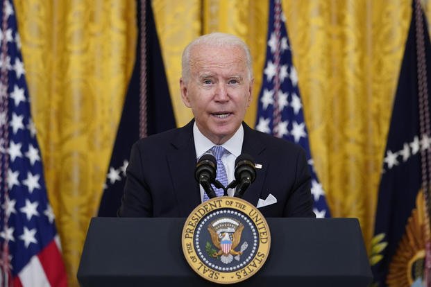 President Joe Biden speaks in the East Room of the White House in Washington