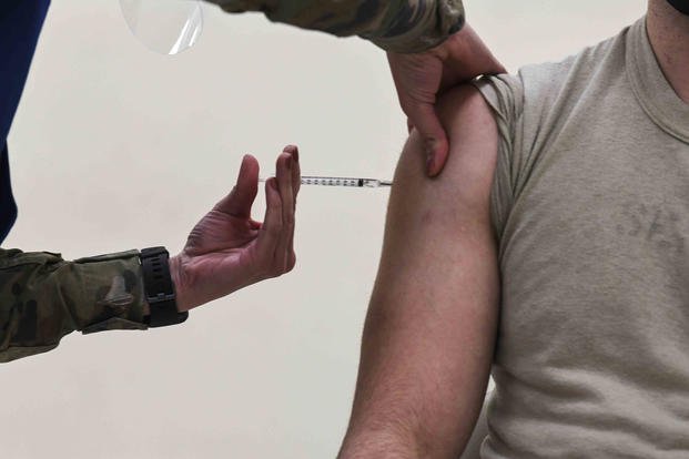 Senior airman receives COVID-19 vaccine.
