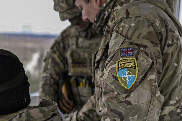 British soldiers evaluate coordinates at the Tapa Training Grounds, Estonia.