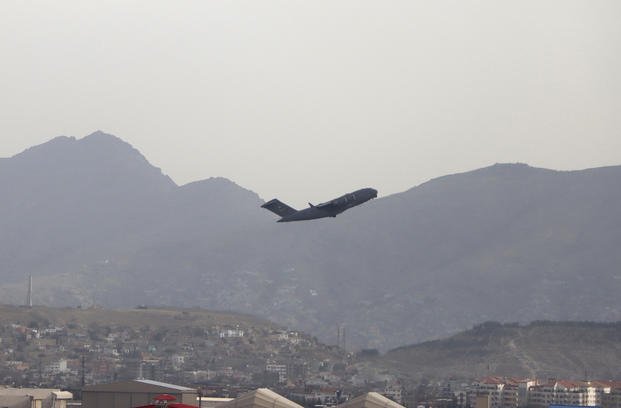 A U.S military aircraft takes off from the Hamid Karzai International Airport