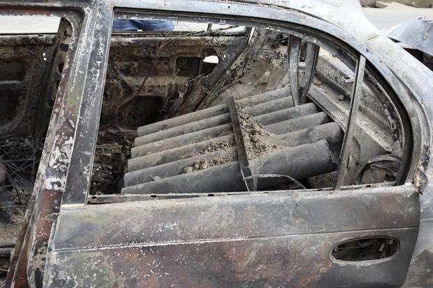 Afghanistan rocket launcher tubes destroyed car