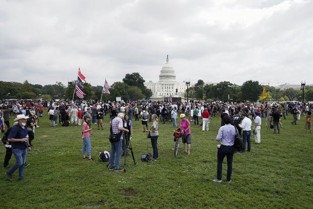 People attend a rally near the U.S. Capitol in Washington