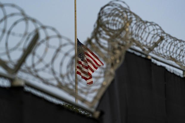 Flag flies at half-staff at Camp Justice in Guantanamo Bay
