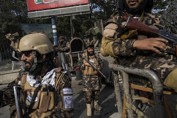 Fighters secure an area during a demonstration in Afghanistan.