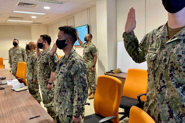 Sailors reaffirm their oath during a Navy-wide stand-down to address extremism