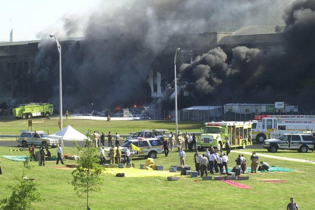 Emergency response teams begin preparing triage areas outside of the Pentagon following the attack, 11 September 2001.