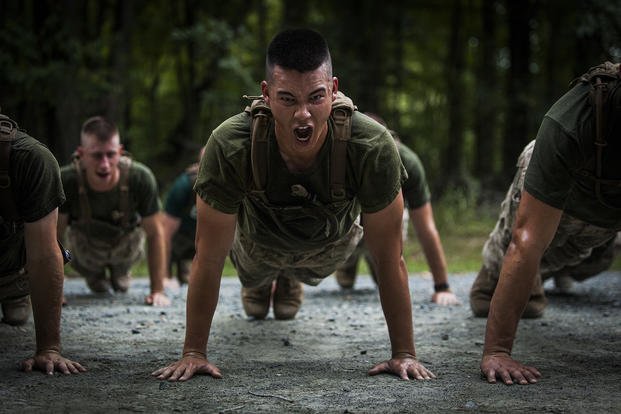 Officer candidates perform push-ups during the Medal of Honor run.